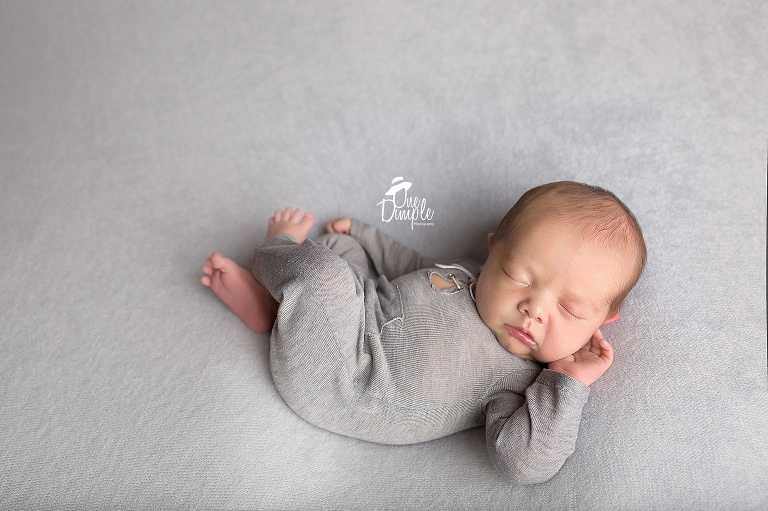 Newborn Boy in Pooks and LuLu Romper